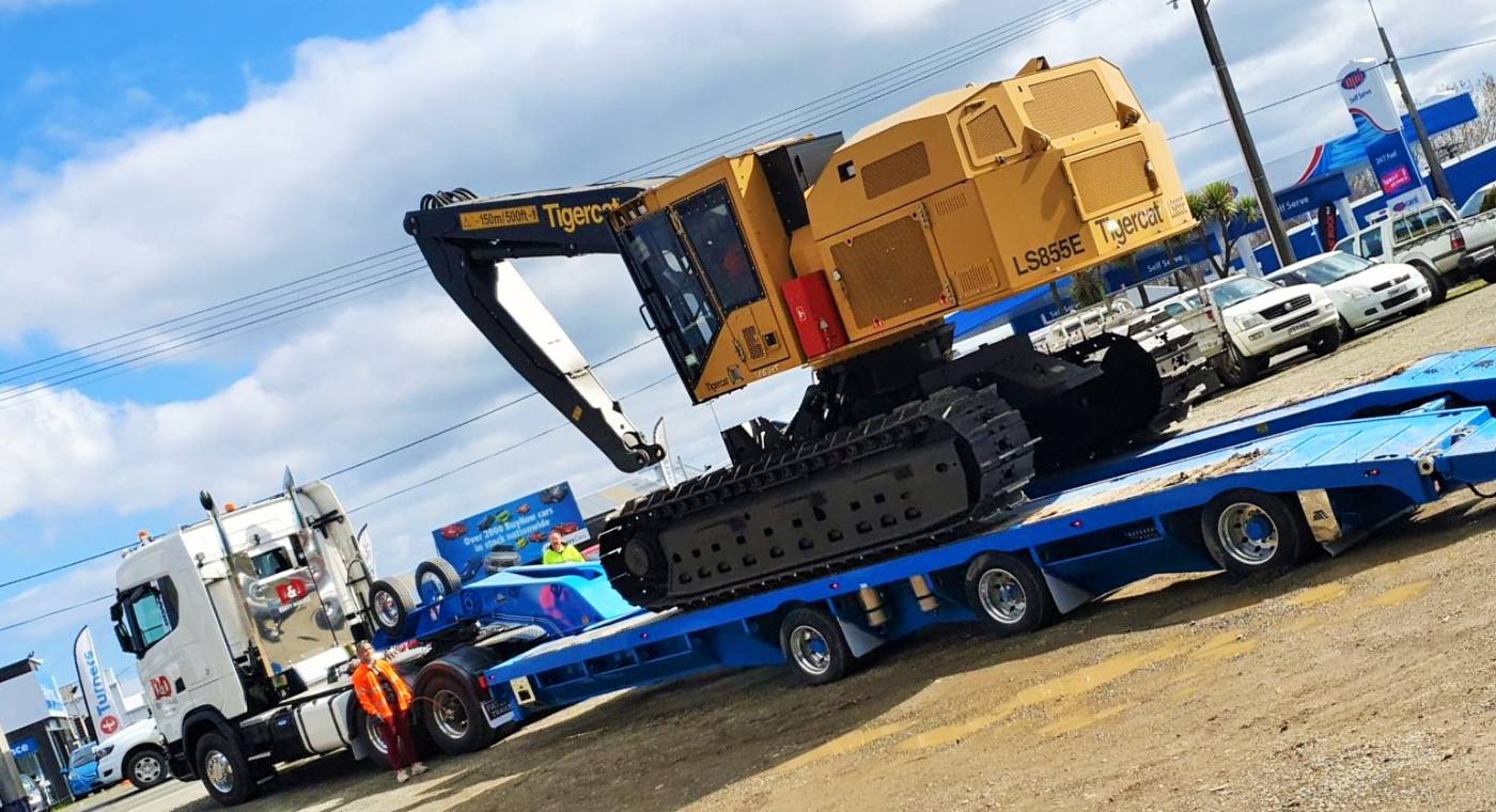Excavator loaded on a transporter trailer