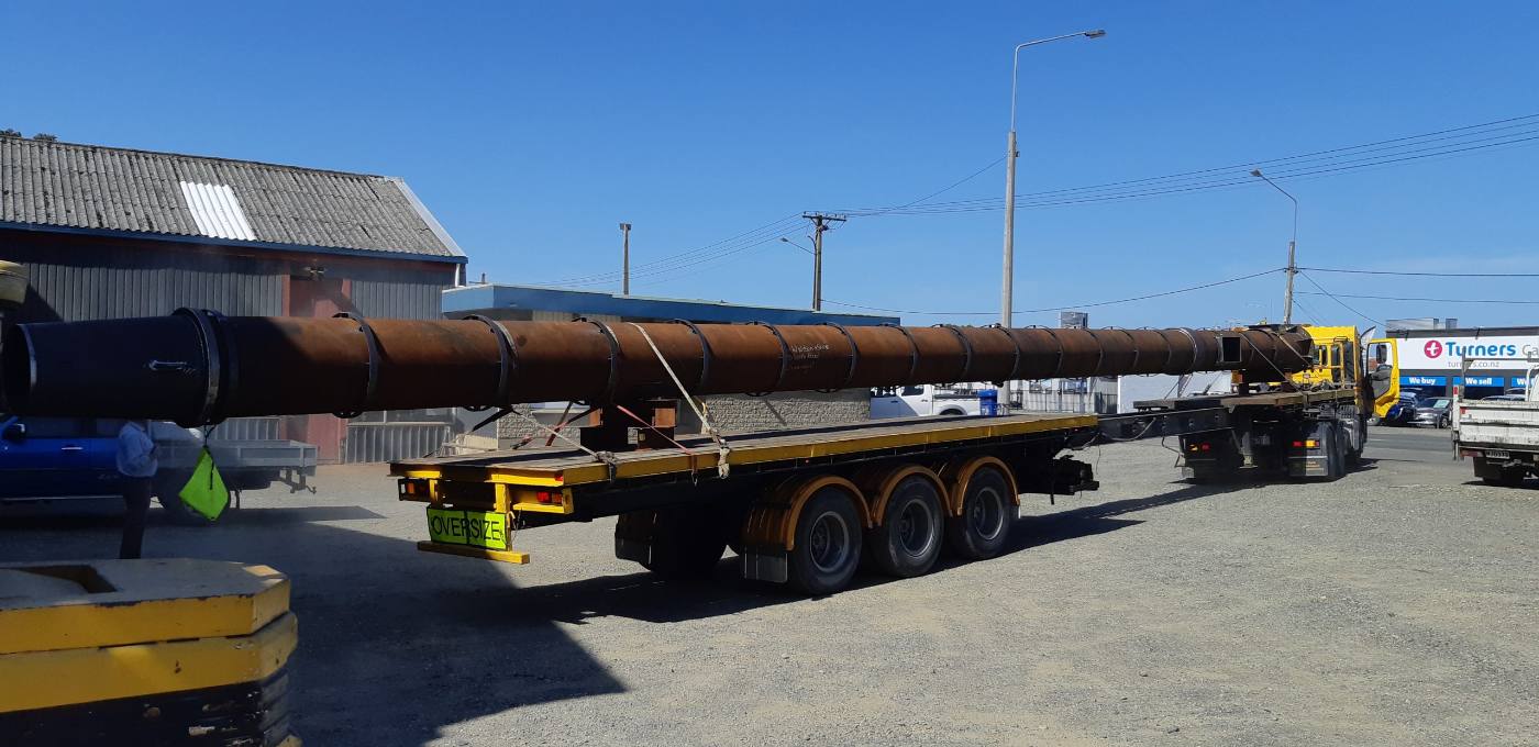 Long steel tube section on a trailer